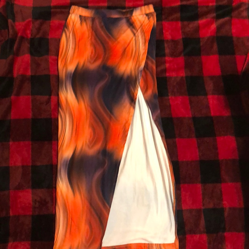 multi color skirt with a long slit on the leg in the front